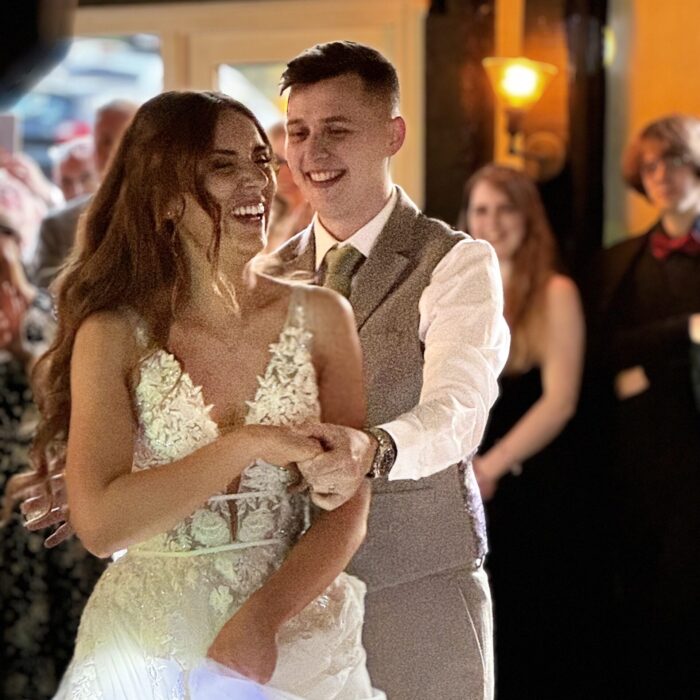 A beautiful couple dance at a wedding
