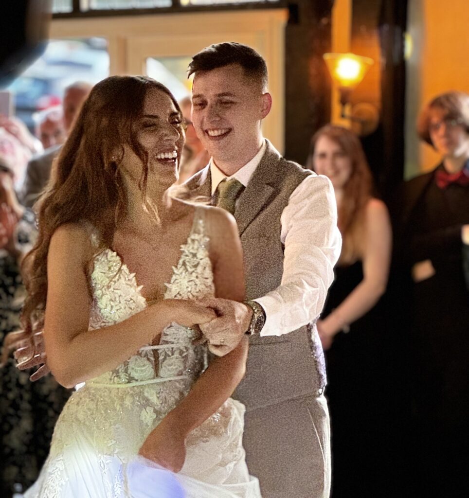 A beautiful couple dance at a wedding