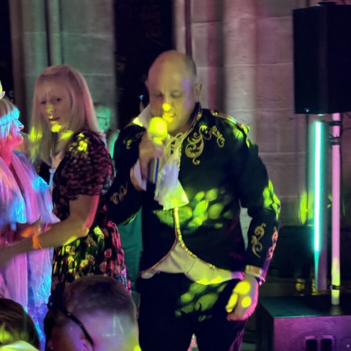 A singer performs under lights