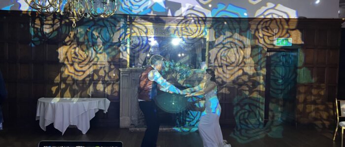 A Wedding Couple dance together under stunning lights for their First Dance
