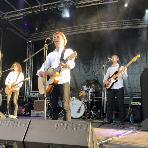 A Live Band sings on a stage